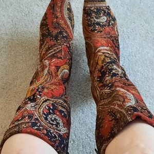 Red and black patterned tall boots